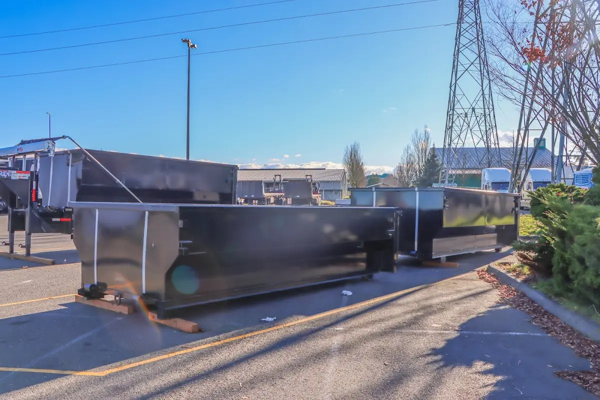 Roll-off dumpster ready for waste disposal at job site for Yard Waste Dumpster Rental in Springdale